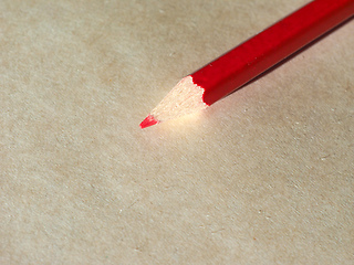 Image showing Red pencil over paper