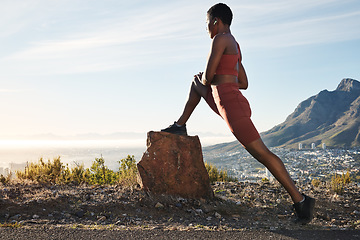 Image showing Black woman, music earphones or fitness stretching in city view workout, training or exercise in marathon, healthcare wellness or muscle pain relief. Runner, sports athlete or person on warm up radio