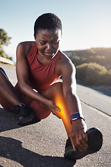 Image showing Fitness, black woman and leg injury from sports, accident or running during workout exercise in the nature outdoors. African woman runner suffering in painful legs from muscle tension, sore or bruise