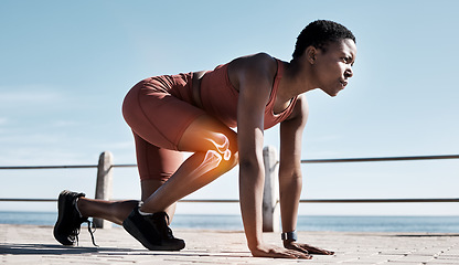 Image showing Black woman, fitness and runner with knee x ray in sports training, workout or exercise in the outdoors. Determined African American woman getting ready for running, race or sprint in motivation