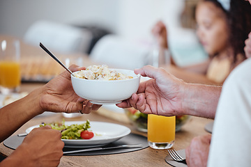 Image showing Food, lunch and hands pass bowl with delicious pasta at home. Brunch, fine dining and family or people eating and sharing a tasty, gourmet and healthy meal on table together in house dinning room