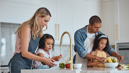 Image showing Family, mother and father with girls in kitchen, rinse vegetables and bonding. Love, mama and dad with daughters, child development and loving to prepare salad together for lunch, veggies and cooking