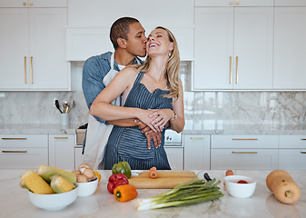 Image showing Couple, cooking food and love of vegetables with a kiss on the cheek while helping with dinner at home. Man and woman in Uk with a healthy lifestyle, diet and vegan eating for health and wellness