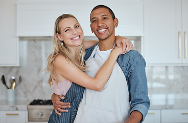Image showing Kitchen, couple and hug portrait with love, care and smile at home ready for meal cooking. Interracial happy couple loving marriage, diversity and diet nutrition in a house hungry for food together