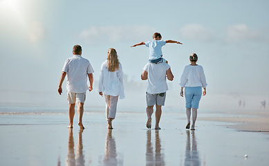 Image showing Family, beach and travel with love and generations, together on vacation in Australia, sea and back view. Holiday, summer and sun, parents, grandparents and child, quality time outdoor and adventure.