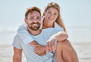Image showing Love, couple and hug at beach on vacation, holiday or summer trip. Portrait, romance or care of man and woman hugging, cuddle or embrace and relaxing, having fun or enjoying time on seashore outdoors
