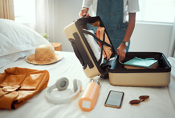 Image showing Suitcase, woman and packing clothes, bag and luggage for travel, vacation and international journey, summer adventure and tourism. Closeup female tourist, hotel room and holiday clothing in baggage
