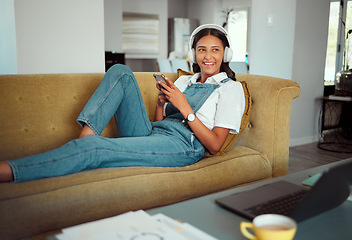 Image showing Phone, happy or girl on social media or online dating website talking, chat or texting while relaxing on sofa. Social network, headphones or excited woman smiles thinking of typing a message a lover