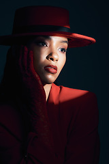 Image showing Dark, spotlight and sexy with fashion and woman with face and seduction with red aesthetic against studio background. Sensual, beauty and skin with makeup and mystery, vintage or retro style.