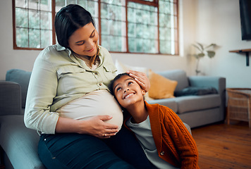 Image showing Pregnancy, family and girl with pregnant mother listening to newborn baby with love, affection and bonding. Family home, maternity and mom on sofa with child with ear to pregnant belly in living room