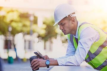 Image showing Construction engineer, man and coffee with phone for typing, reading notification or architect management in city. Industrial contractor, smartphone and coffee break for online mobile tech connection