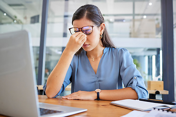 Image showing Stress headache, burnout and woman in office overwhelmed with workload at desk with laptop. Frustrated, overworked and tired woman with computer at startup, anxiety from deadline time pressure crisis