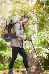 Image showing Fitness, forest or woman hiking for exercise, cardio training or healthy workout with fresh air in summer. Smile, traveling or happy Indian girl hiker trekking, journey or walking in nature or woods