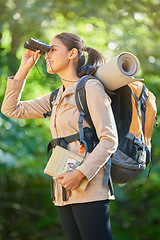 Image showing Adventure, hiking and woman trekking in nature, bird watching and search in the forest of Taiwan. Travel, smile and girl with binoculars to check for birds while on a walking holiday in a jungle