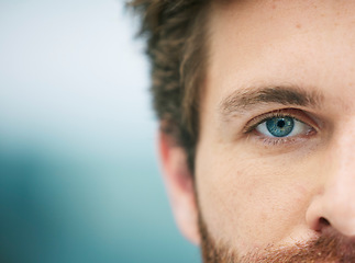 Image showing Half face, eye and man with free space for advertising and marketing eye care, contact lenses and vision for bright future. Macro of blue eyes male for security, biometrics and identity recognition