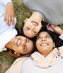 Image showing Friends, happy and relax with laugh, face and enjoy fun quality time together in outdoor nature park. Grass floor, top view and face of happy women smile and support on holiday in Miami, florida