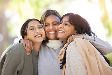 Image showing Women friends, hug and smile in park for happiness, support and relax in sunshine at best friends reunion. Woman group, happy and love embrace with care, nature and blurred background in Los Angeles