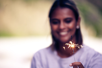 Image showing Party, birthday and woman with sparkle in hand for Christmas, festival celebration and new years. Light, fireworks and girl holding sparkler to celebrate holiday, vacation and festive event in nature