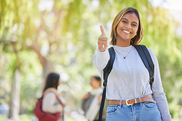 Image showing Thumbs up, university and student or woman in park for scholarship, education and future goals success in a portrait smile. Happy woman on college, school or academy campus with like or yes hand sign
