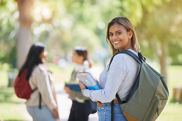 Image showing Education, university and woman student with learning, scholarship and college campus, book for reading and study in academic portrait. Young girl smile, backpack and learn with knowledge in Boston.