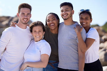 Image showing Hug, happy and portrait of friends at the beach, ocean travel and smile on holiday in Miami. Nature, summer diversity and men and women at the sea for vacation, affection and happiness as a group