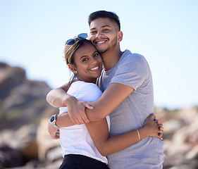 Image showing Love, beach and portrait of couple hug enjoying summer vacation, holiday travel and weekend together. Dating, romance and young man and woman hugging, smile and bonding for quality time in nature