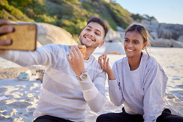 Image showing Couple, phone selfie or picnic on beach anniversary celebration, birthday or love date with pizza takeaway food. Happy smile, bonding man or woman on mobile technology photography with meal by ocean