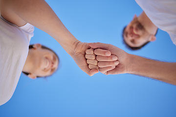 Image showing Happy, teamwork or couple of friends fist bump in celebration of success, marriage goals or solidarity in partnership. Low angle, man and womans hands celebrate goals, mission or commitment support