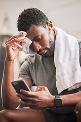 Image showing Black man, phone and sweat for relax fitness or typing sports communication online, exercise training and runner workout. Cardio wellness, run motivation rest or athlete reading on smartphone in gym