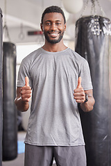 Image showing Thumbs up, fitness or black man for wellness portrait, exercise or positive mindset in sport gym. Thank you, support or happy personal trainer for workout motivation, success training or health goal