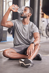 Image showing Black man drink water, fitness and gym with challenge workout training for muscle and thirsty with motivation, goals and sweating. Tired sports, athlete person with water bottle in health exercise