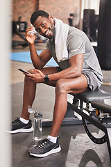 Image showing Fitness, phone and portrait of a man at gym for training, exercise and cardio while texting or checking wellness app progress. Face, black man and social media health influencer post workout for blog