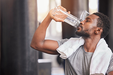 Image showing Fitness, drinking water and relax with black man in gym for training, endurance and workout. Energy, focus and sweat with athlete bodybuilder cooling down in club for sports, exercise and cardio