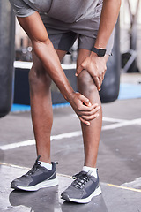 Image showing Fitness, injury and knee pain of black man at gym with inflammation problem resting legs. Joint pain, accident and cardio exercise person injured training at health club trauma assessment.