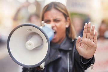 Image showing Woman, megaphone and hand in protest to stop gender based violence, discrimination or equality in the city. Angry female activist shouting, protesting or announcement for human rights or awareness