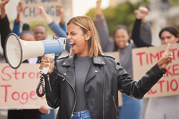 Image showing Protest, demonstration and woman with megaphone in city shouting for justice, freedom and equality. Free speech, human rights and crowd of people marching for social change, revolution and politics