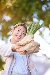 Image showing Grocery, shopping bag and Asian woman with vegetables in city after buying healthy or nutritious plants at market. Wellness, sales deals and female vegan with products after purchase at supermarket.