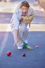 Image showing Drop, accident and woman with groceries in the street, clumsy and trip while walking with shopping bag in the city of Japan. Falling, tripping and wow of an Asian girl with grocery food in the road