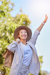 Image showing Asian woman, shopping bag and stop taxi in city outdoor after buying clothing in town. Travel, sales deals and happy female from Japan holding gifts after shopping on Black Friday for cheap discount.