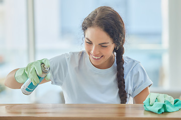 Image showing Cleaning, table and happy woman spray with cloth for dirt, dust or bacteria on furniture at home. Happy cleaner, housekeeping and maid wipe wood surface, maintenance care and spring cleaning services