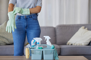 Image showing Black woman hands for cleaning, product in basket on table for home maintenance tools or living room spring cleaning. Cleaner, container or maid with brush or liquid spray bottle for cleaning service