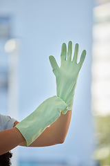 Image showing Woman, hands and gloves for cleaning home, hygiene and wellness. Spring cleaning, housekeeper or female cleaner getting ready for cleaning service to disinfect house to remove bacteria, germs or dust