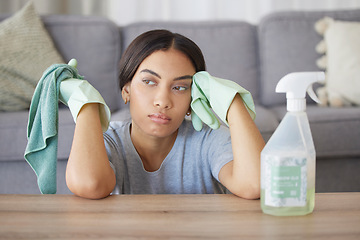 Image showing Tired, woman in home or spray bottle with cloth, mental health or exhausted with cleaning. Hispanic female, cleaner and sad maid in living room, rag or disinfectant with depression, stress or anxiety