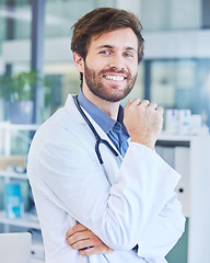 Image showing Portrait, man and doctor in hospital, smile and confident at work, wellness or healthcare for community. Male, medical professional or surgeon ready to help, assist or consult for advice or diagnosis