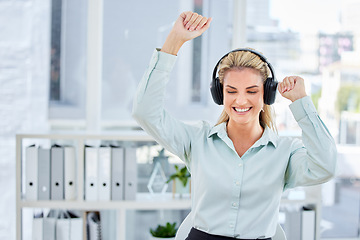 Image showing Business woman, happy office and headphones for dancing and listening to music to celebrate achievement, success or bonus after reaching target or goal. Entrepreneur doing winning dance to sound