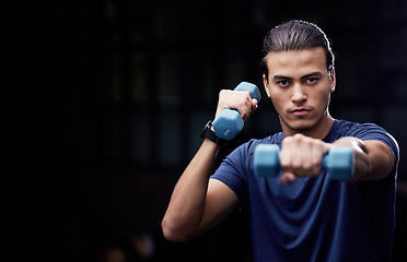 Image showing Portrait, fitness and man with dumbbells in studio for training, health and exercise on black background with mockup. Face, weightlifting and guy at gym for workout, wellness and muscle goals mock up