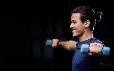 Image showing Man, fitness and dumbbells with smile by black background for health, wellness or muscle development. Happy young bodybuilder, weightlifting or workout for strong arms, training or exercise in studio