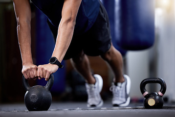 Image showing Exercise, kettlebell and strong hands man doing gym workout with a fitness watch during muscle training as bodybuilder with metal weights. Athlete with smartwatch to train for power and health goals