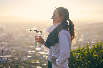 Image showing Water bottle, woman and mountain hiking of a person on a adventure on Hollywood hills. Training, fitness and sunset view of a traveler on a hike for summer holiday travel calm about vacation walk