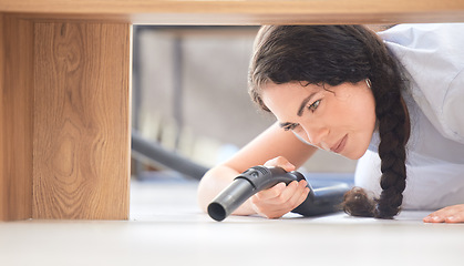 Image showing Vacuum, woman on floor and clean for dust, bacteria and hygiene in home. Housewife, cleaner and maid housekeeping, cleaning service and furniture with machine, fresh and in lounge for disinfectant.